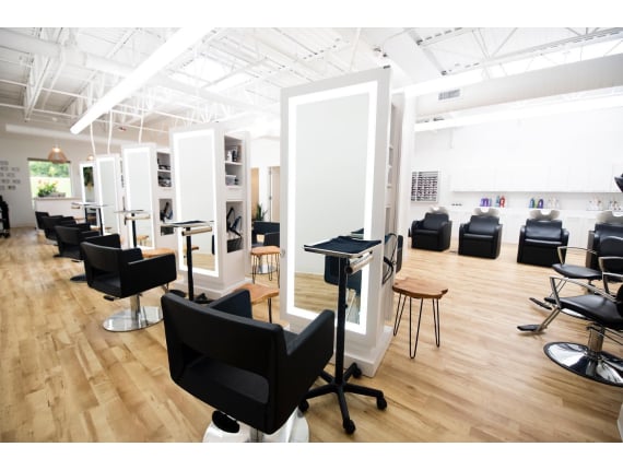 Styling chairs and double-sided stations at Brooks & Harlow Salon in Victor, NY